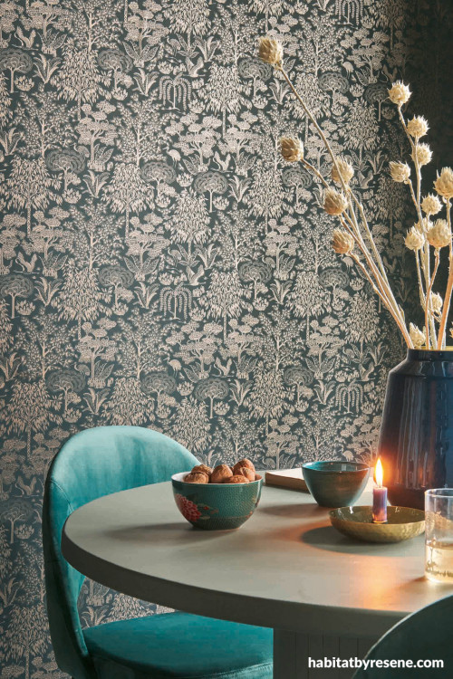 Dark floral wallpaper fits just right into small dining space