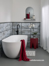 Bathroom, white bathroom featuring pops of red against grey and white