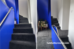 Blue stairwell painted in Resene Aquamarine