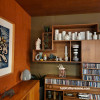 Living area with art, living area with display shelves, living area with art and ceramics