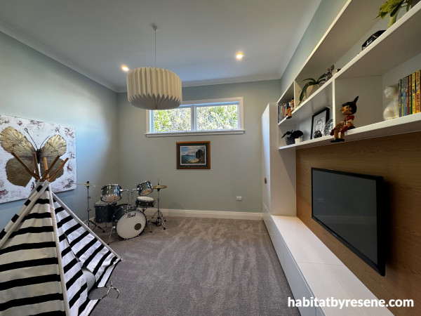 The separate lounge and play area for the children is painted in Resene Quarter Periglacial Blue with trims and ceiling in Resene Alabaster.  