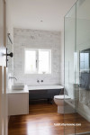 bathroom, white bathroom, neutral bathroom, renovated bungalow, clawfoot bath, bathroom feature wall