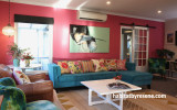 living room, lounge, pink lounge, pink feature wall, blue sofa, pink and blue, resene rouge