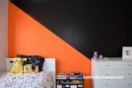 orange feature wall, orange and black, kids room, boys room, resene adrenalin, resene all black